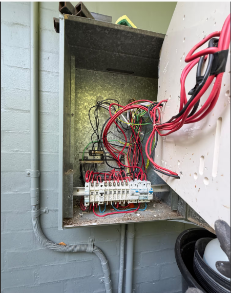 Switchboard opened up by an electrician for repair
