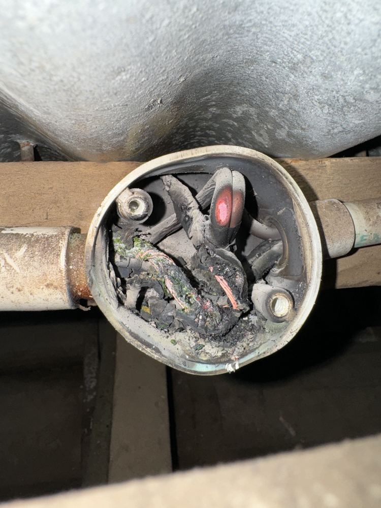 Melted, burnt wiring inside a junction found by an electrician