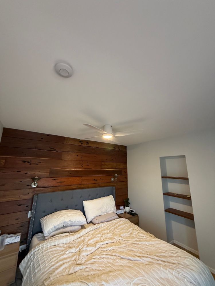 Ceiling fan with light installed in a bedroom in Seven Hills