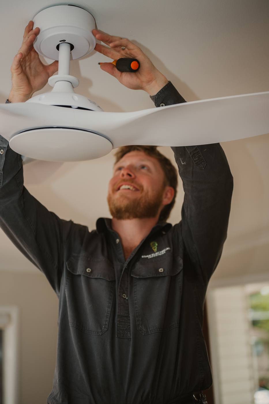 Installing a white ceiling fan