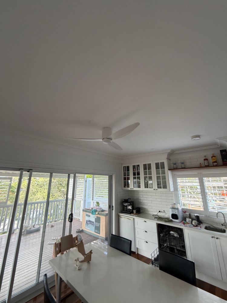 White ceiling fan installed in a kitchen and dining area in Seven Hills