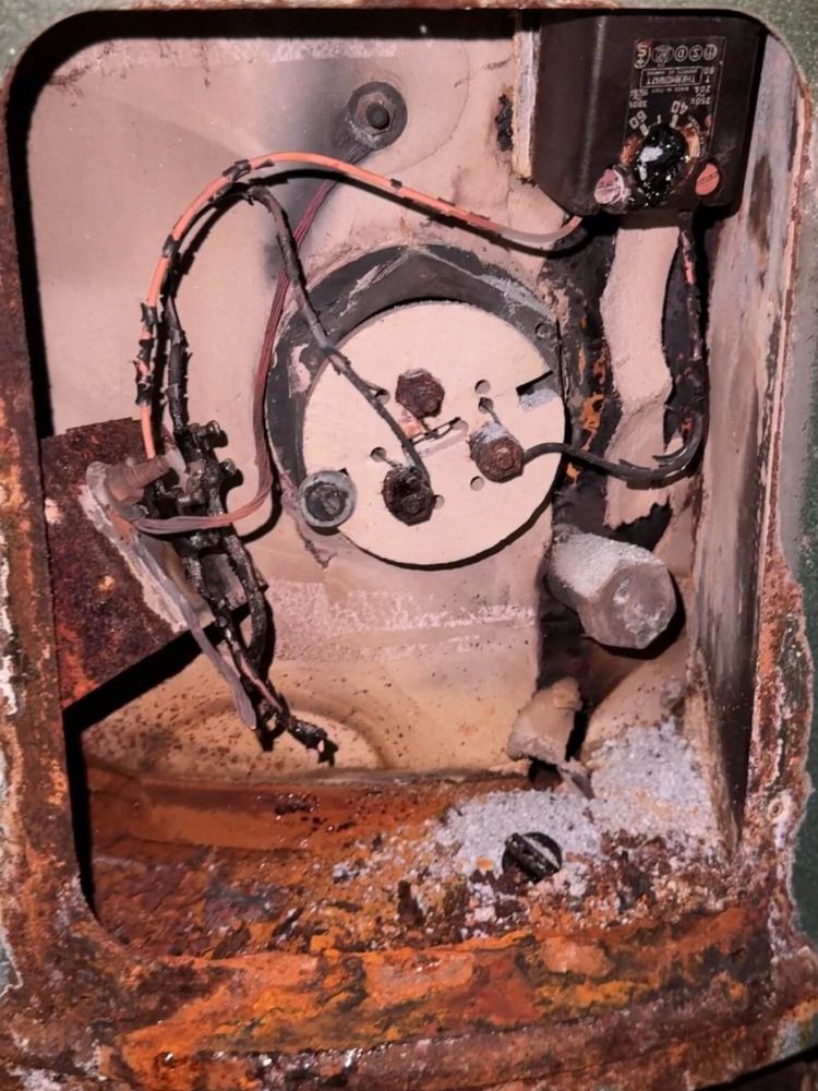 Fire-damaged hot water system element housing