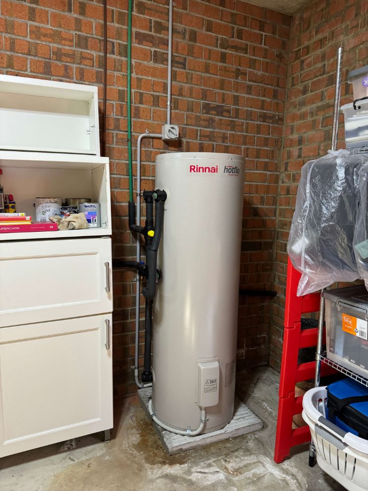 Electric hot water system in a laundry