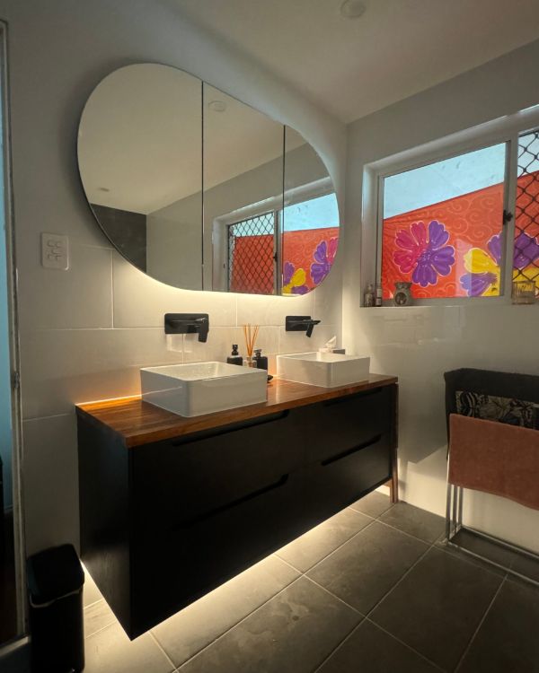 Renovated bathroom with new lighting and wiring in Warner